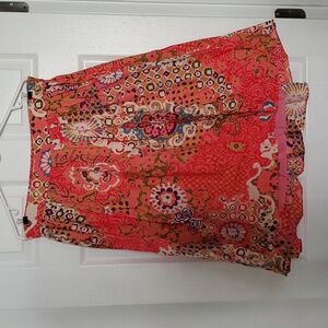Great skirt. Vibrant colors. Lots to wear with it. Excellent condition.